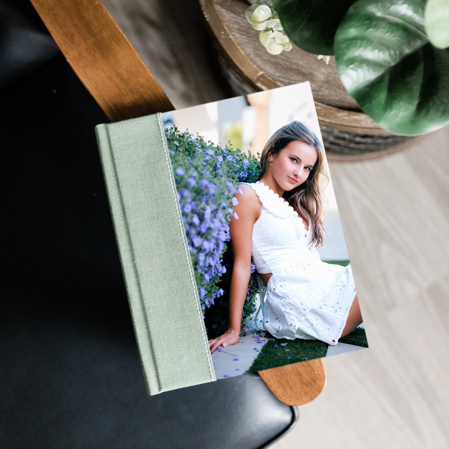 whcc_album-on-chair-arm-with-plant_651285.jpg