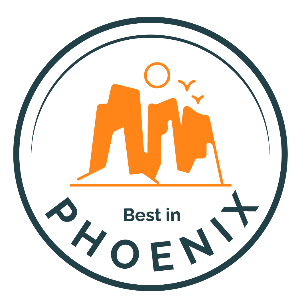A circular logo featuring orange mountains, a setting or rising sun, and birds with the text "Best in Phoenix" around the bottom inside the circle.
