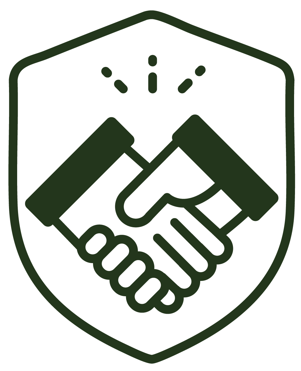 Icon of two hands shaking, surrounded by a shield, symbolizing cooperation or agreement.