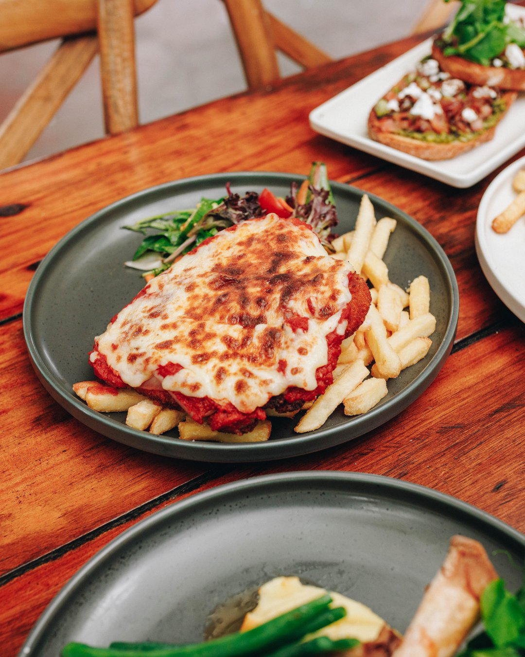 Needing a little moral support? We prescribe parmi&rsquo;s for that 🤝🍻⁠
⁠
Golden crumb, melty cheese, proper pub comfort. We&rsquo;ve been told ours are a bit special&hellip; but we&rsquo;ll let you be the judge of that.⁠
⁠
Come try the magic of pa