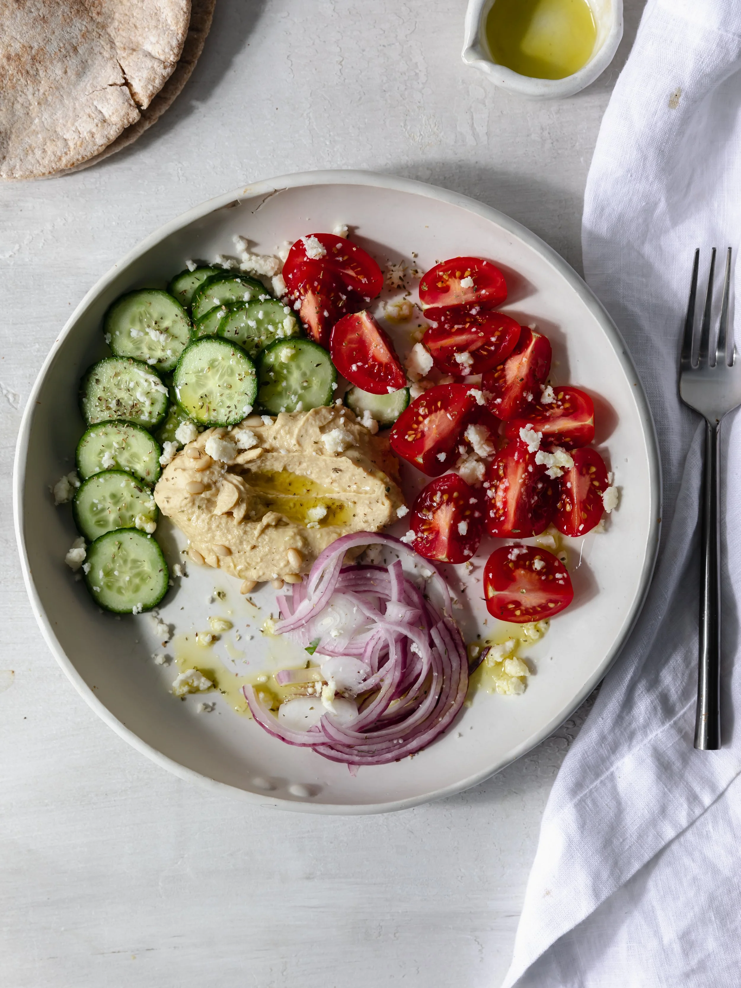 traditional greek salad with hummus and feta