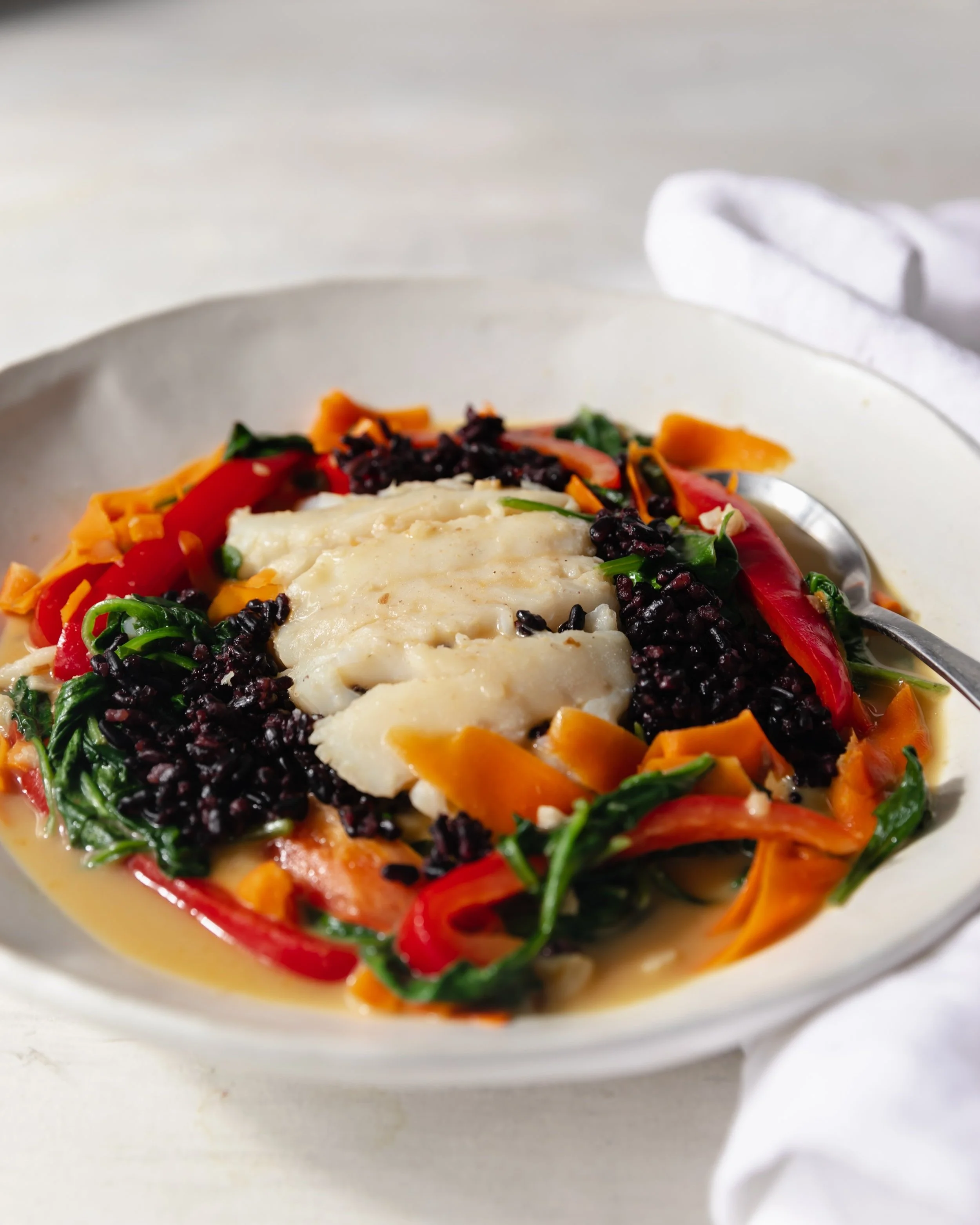 Coconut Poached Cod Over Black Rice — Kelly Powers