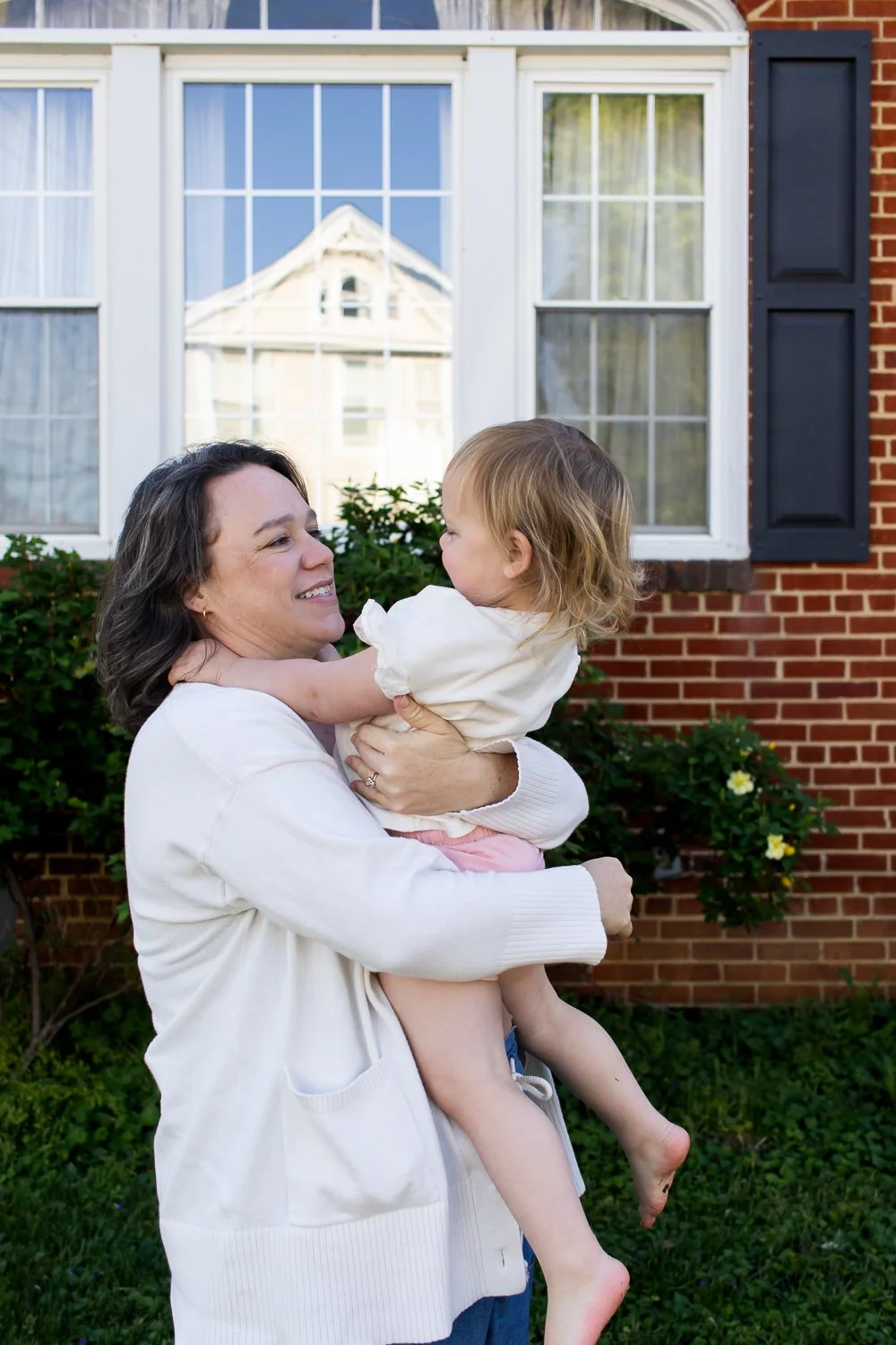 Mother Daughter front yard snuggle