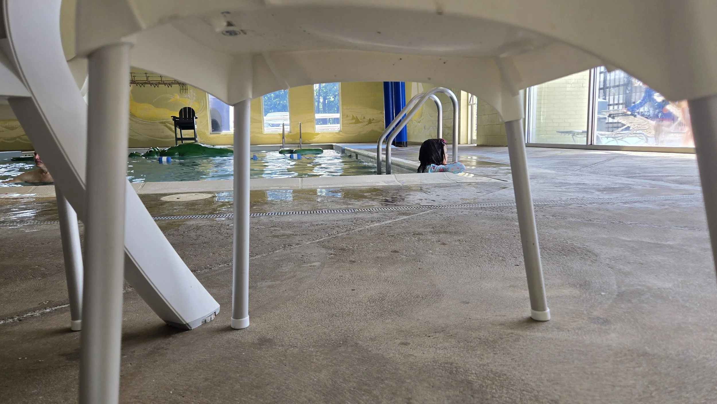 A little girl relaxes against the side of an indoor pool in Chesterfield, VA.