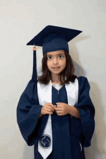 A gif of the photographer's daughter throwing her pre-k graduation cap into the air.