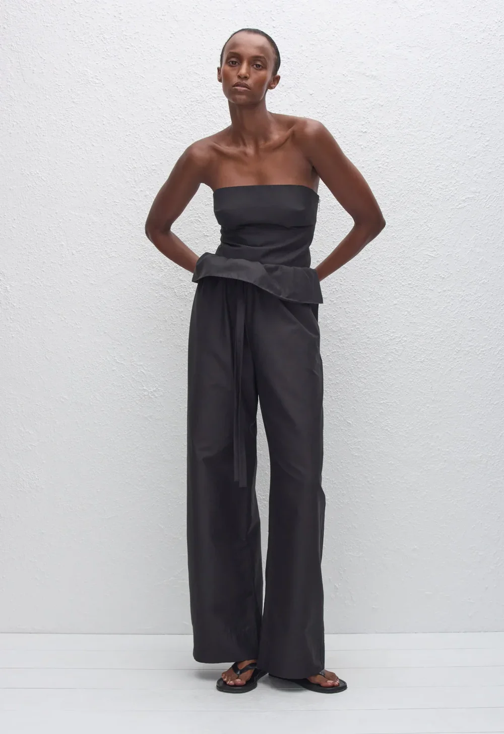 STBBL_BLACK_STRAPLESSTIEBACKBLOUSE_GWATR_BLACK_GATHEREDWAISTTROUSER_MODELDay04_Edyll6663_1440x.webp