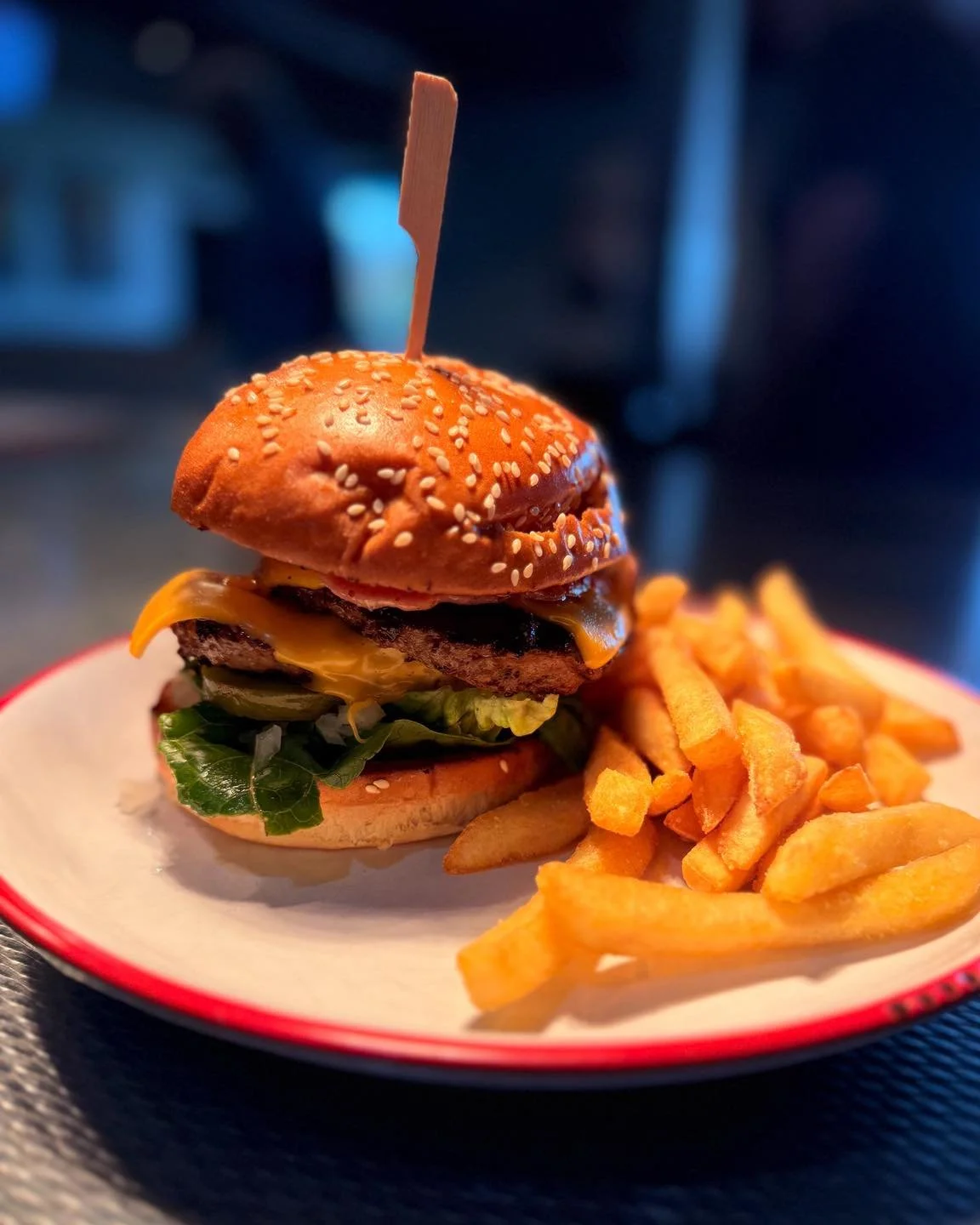 Today for International Burger Day, Central Lane is turning up the indulgence.

Two juicy beef patties stacked with melted cheese, crispy bacon, lettuce, tomato and onion, finished with a house-made mustard mayo on a toasted sesame bun.

Satisfying a