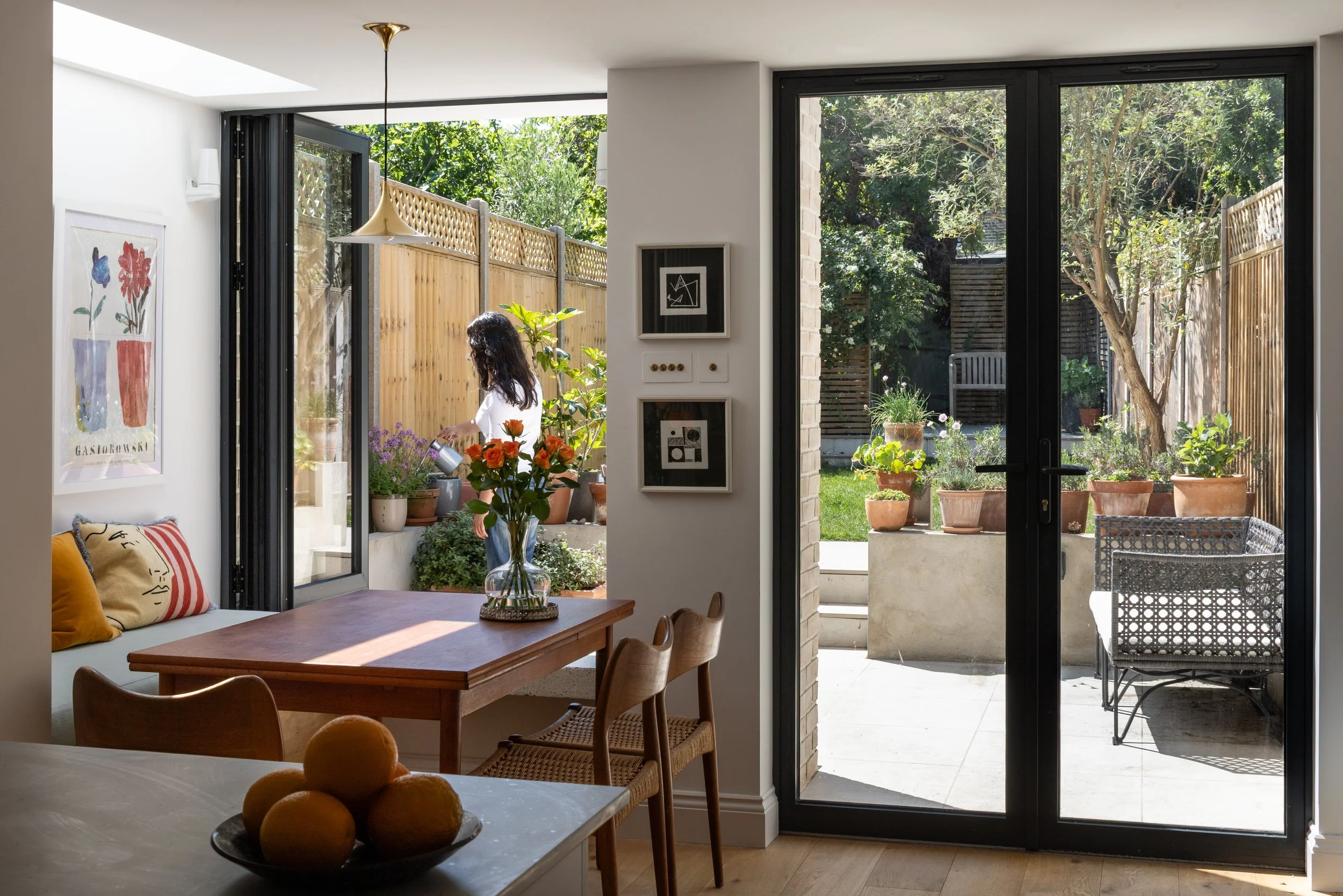 Inside-Out House, Brockley, London – Rear View from Timber Extension out to Courtyard Garden by Studio Manifest Architects