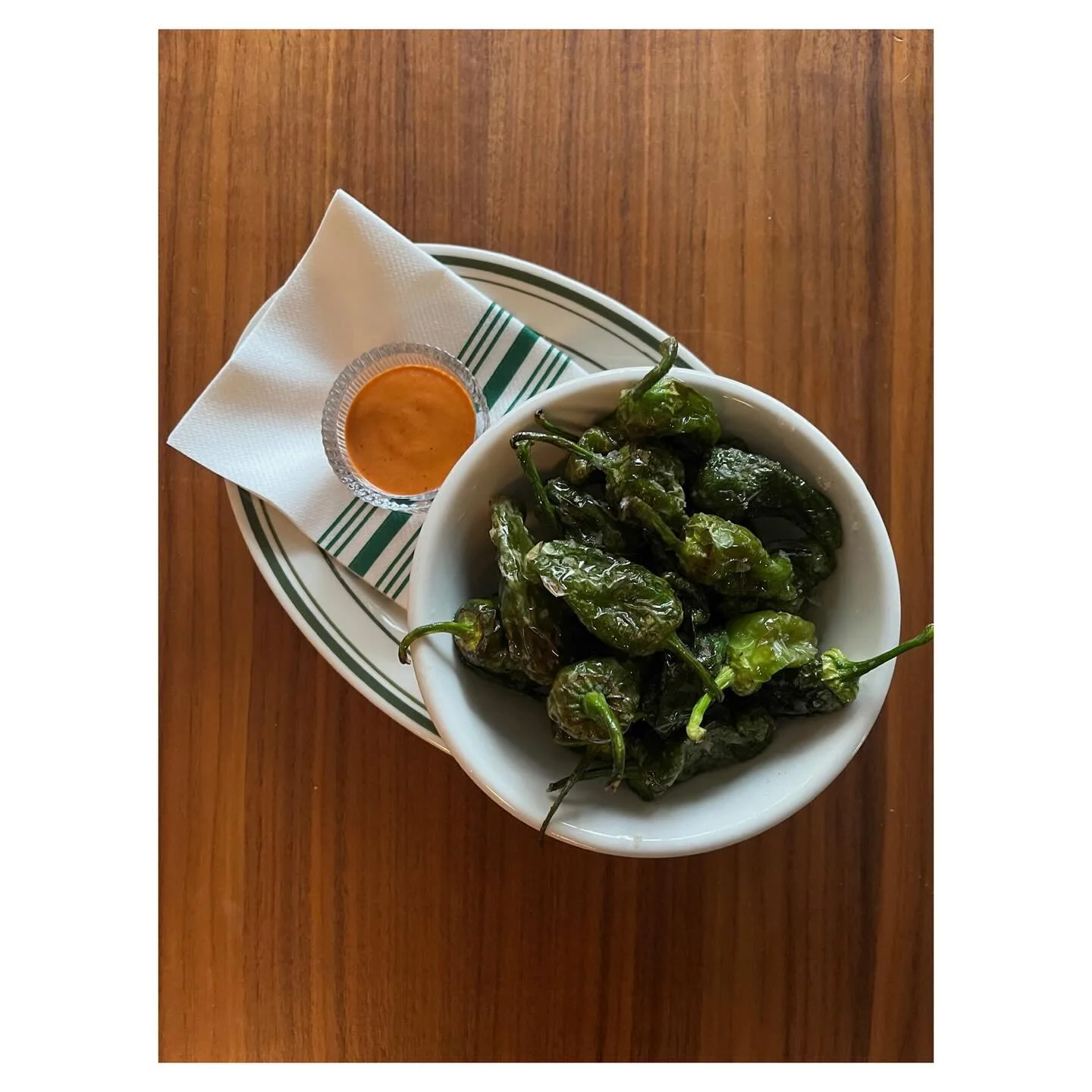 Your new favorite starter: blistered Padron peppers + chimichurri rojo = magic 🌶️🔥