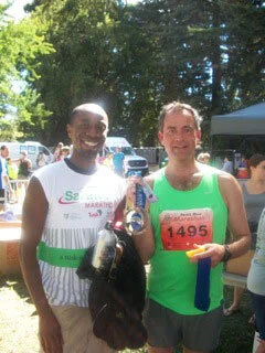 Coach Cory Nyamora (left) was at Santa Rosa to cheer on the runner