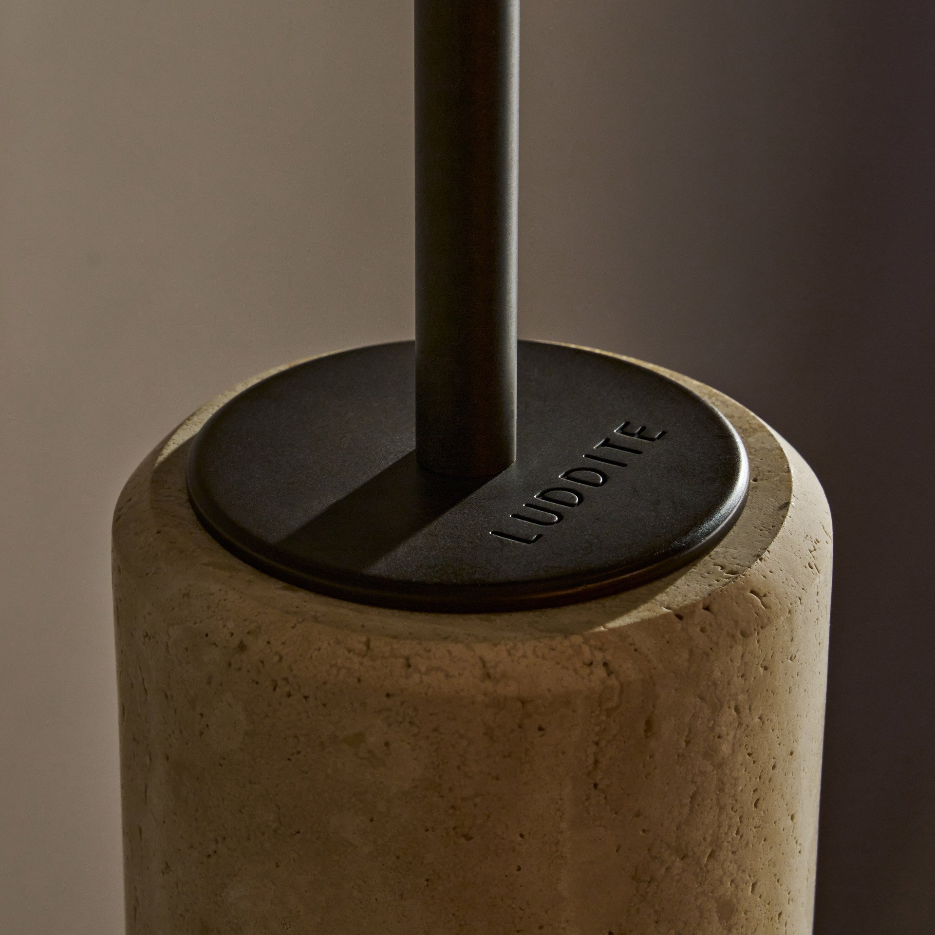 The Dover ceiling pendant features hidden fastening, seamlessly blending stone and glass components. Its cylindrical shade reveals an asymmetric profile from the side. (Copy)