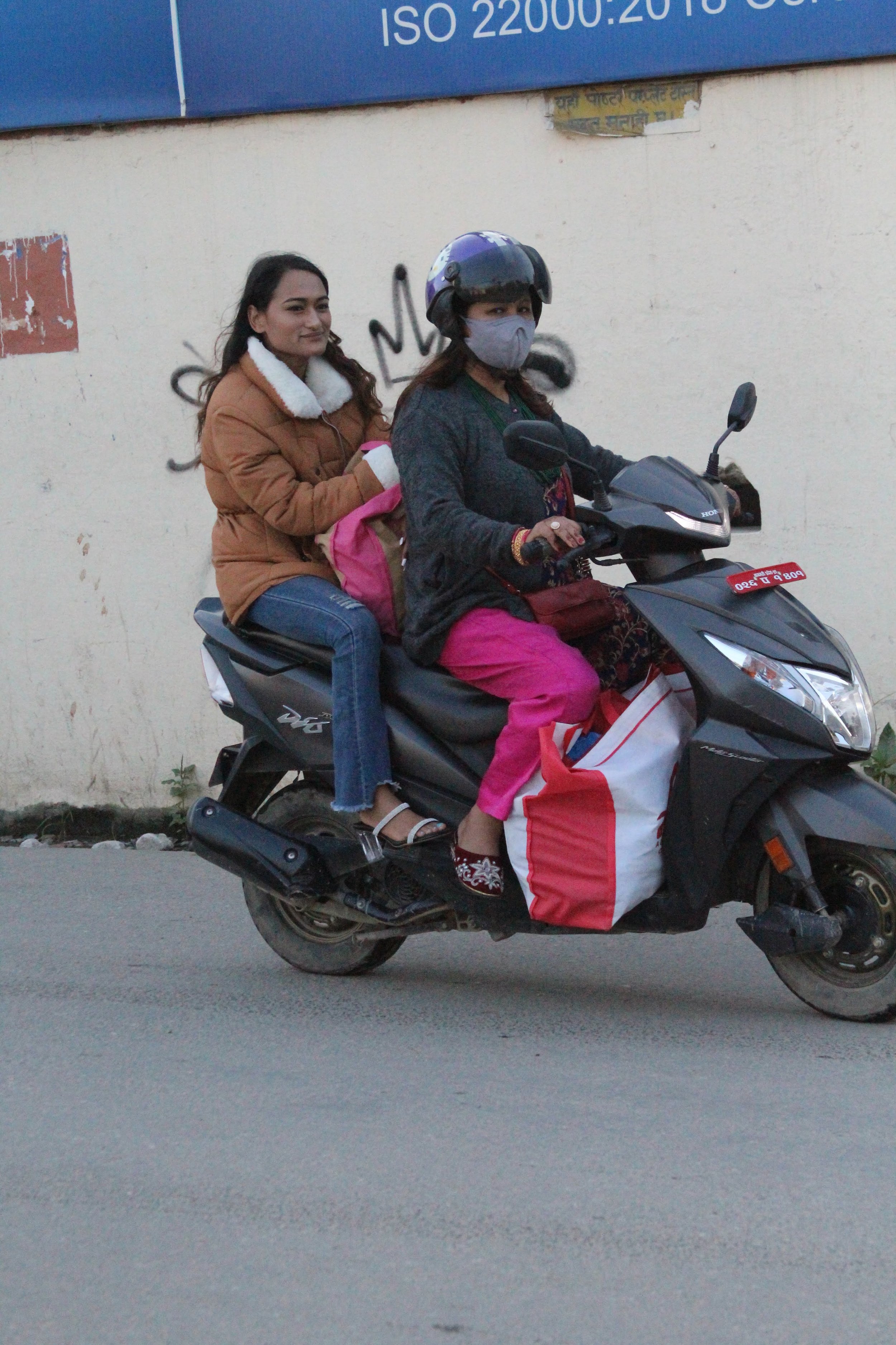 Scooter riders in Kathmandu, Nepal