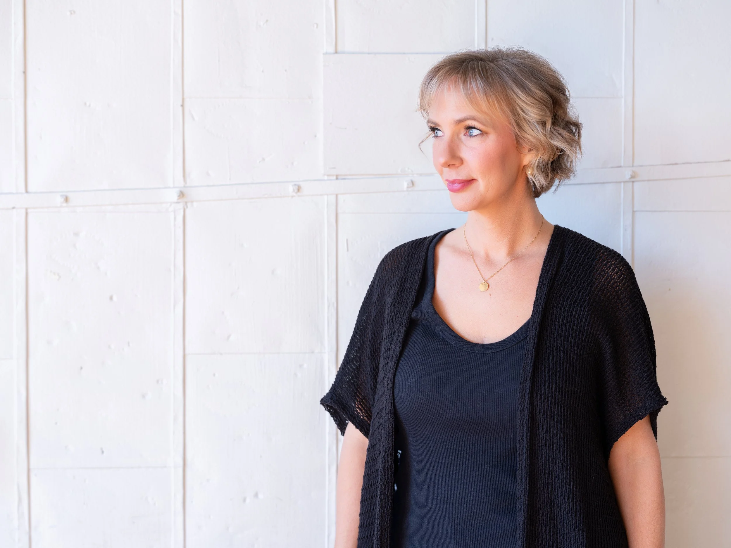 Natural light branding portrait of a professional makeup artist inside The Pointe in NULU, Louisville.