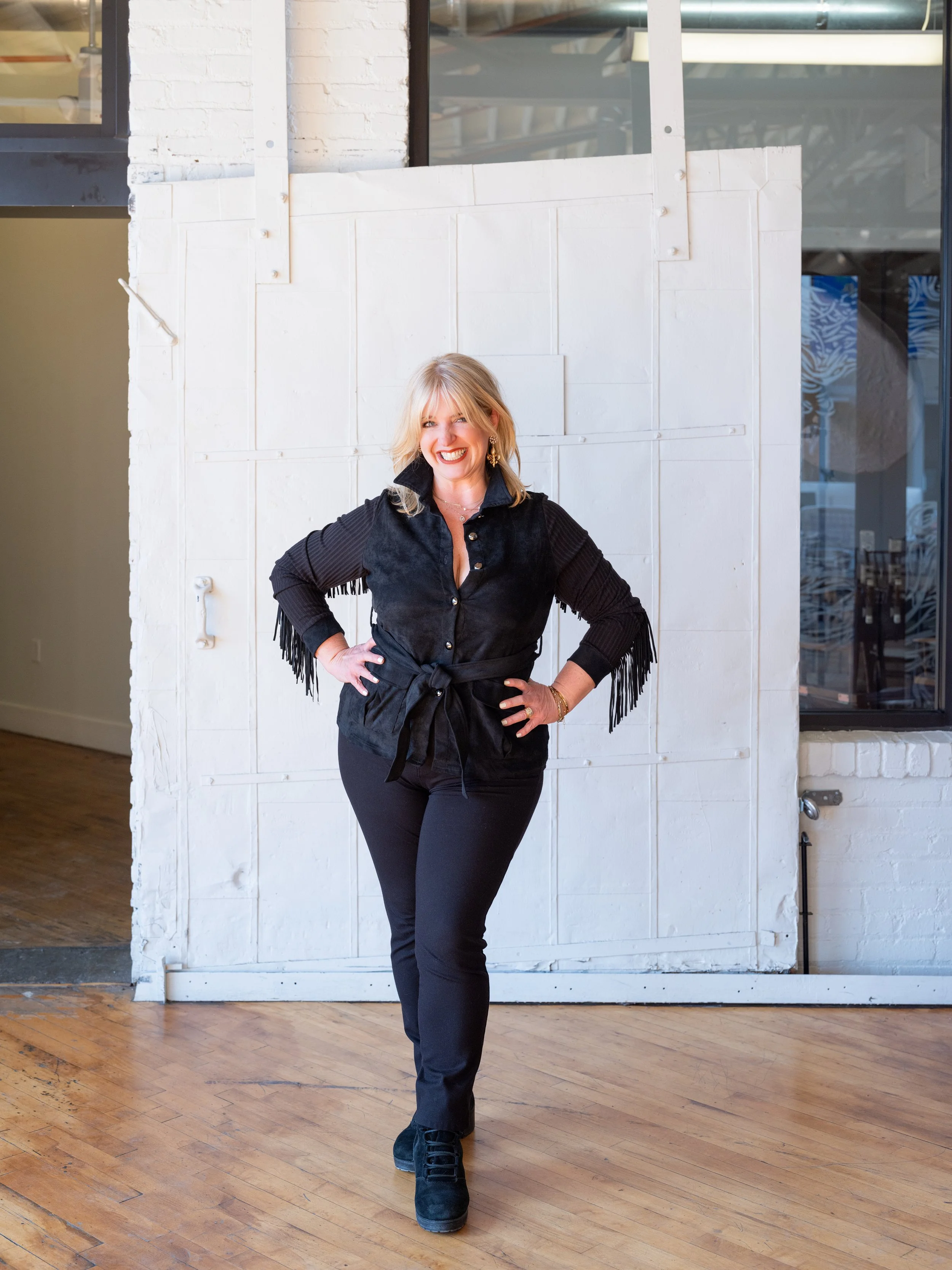 Natural light branding portrait of a professional makeup artist inside The Pointe in NULU, Louisville.