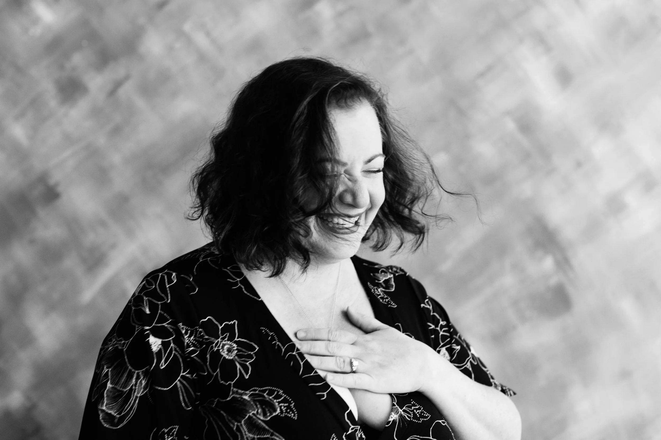 black and white portrait of woman laughing