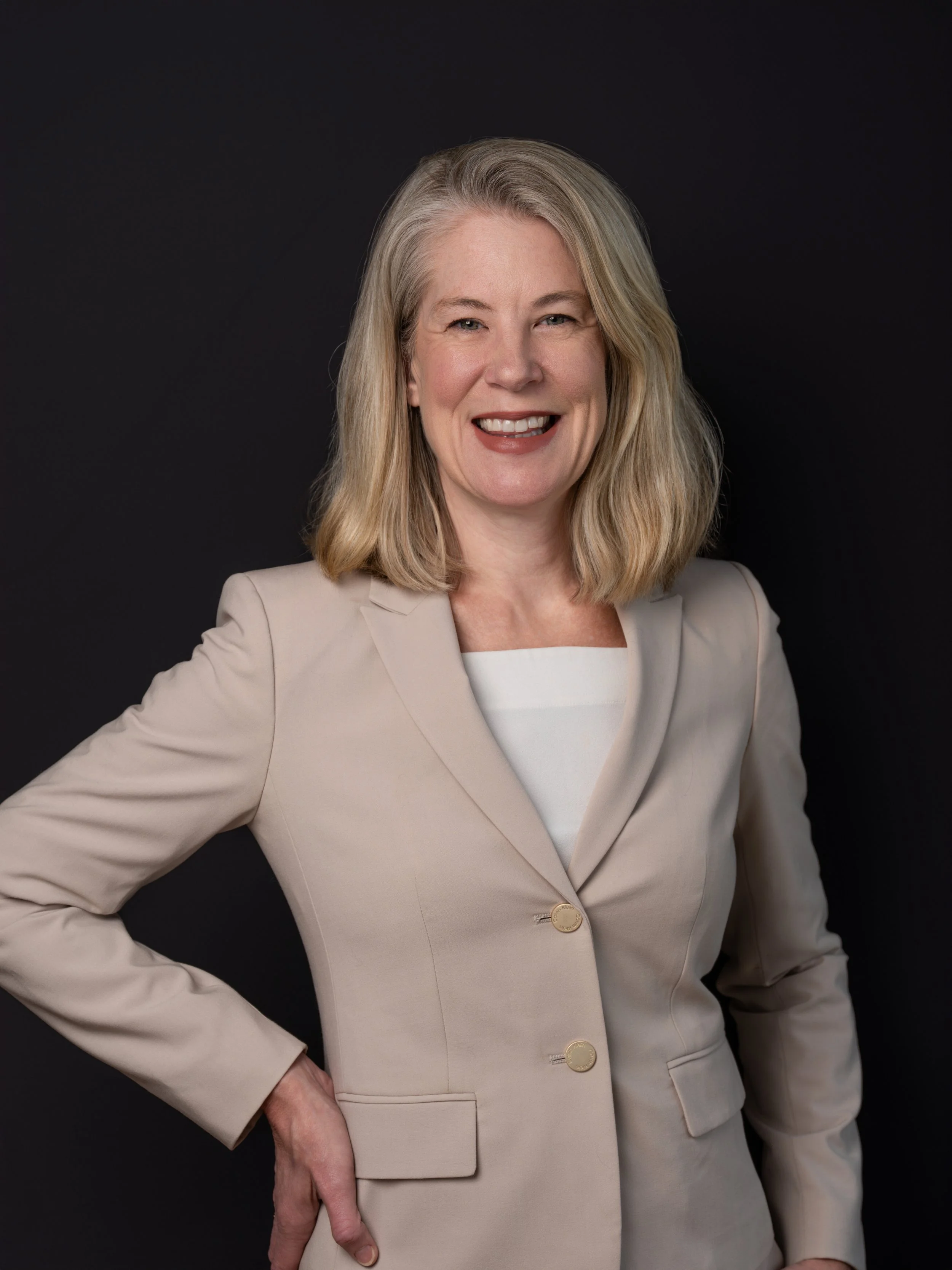 Team headshot style portrait with clean backdrop and polished posing for business profiles.