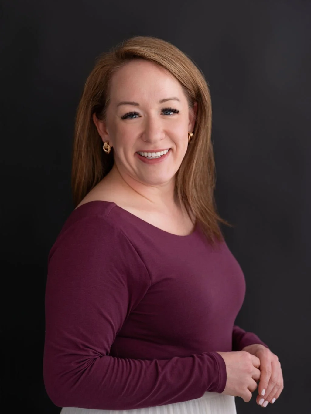 Modern professional headshot created in a Louisville studio with clean lighting and a polished, confident expression.