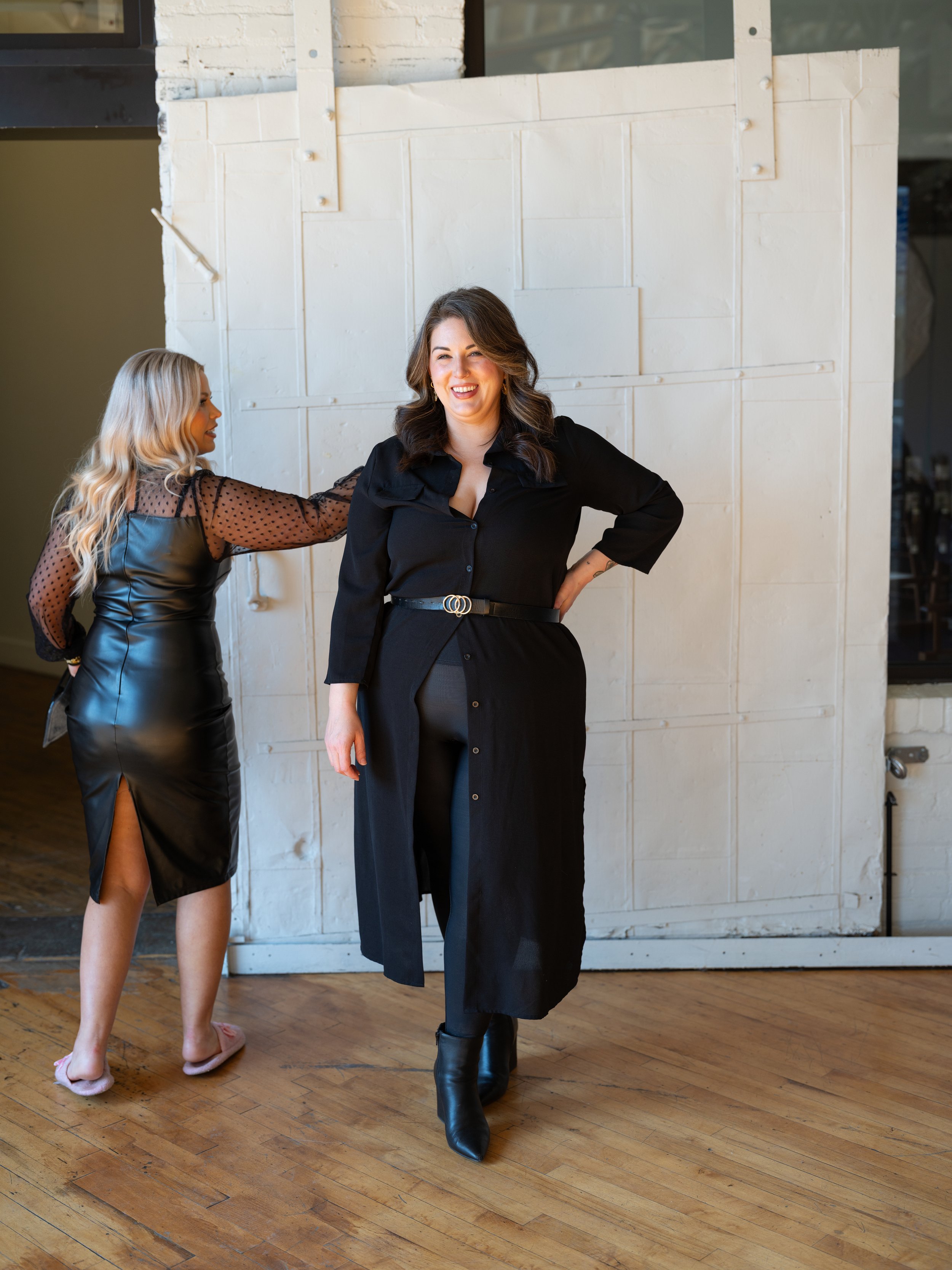 Candid team branding portrait of Louisville hair and makeup artists captured with natural movement and energy.