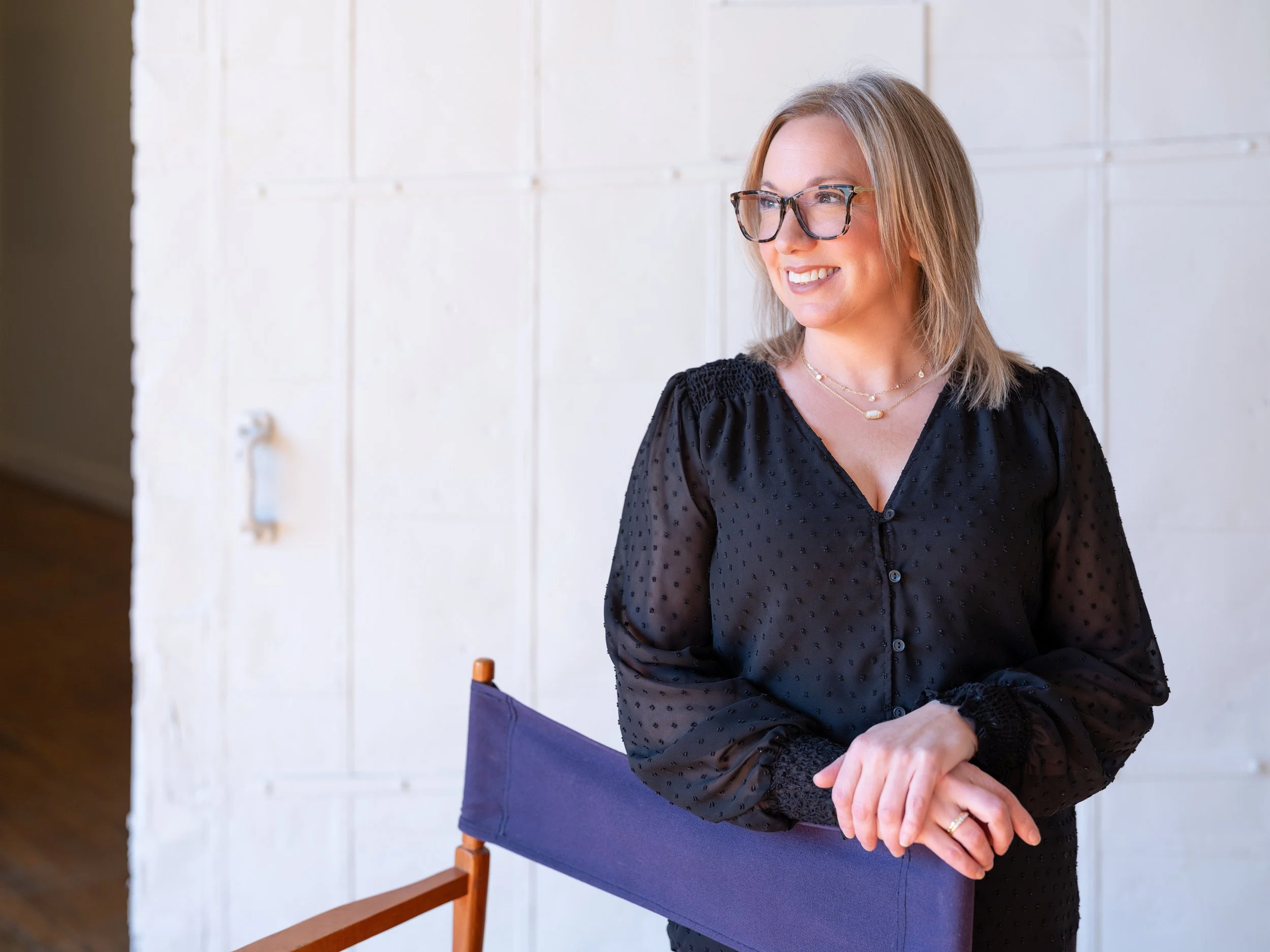 Natural light branding portrait of a professional makeup artist inside The Pointe in NULU, Louisville.