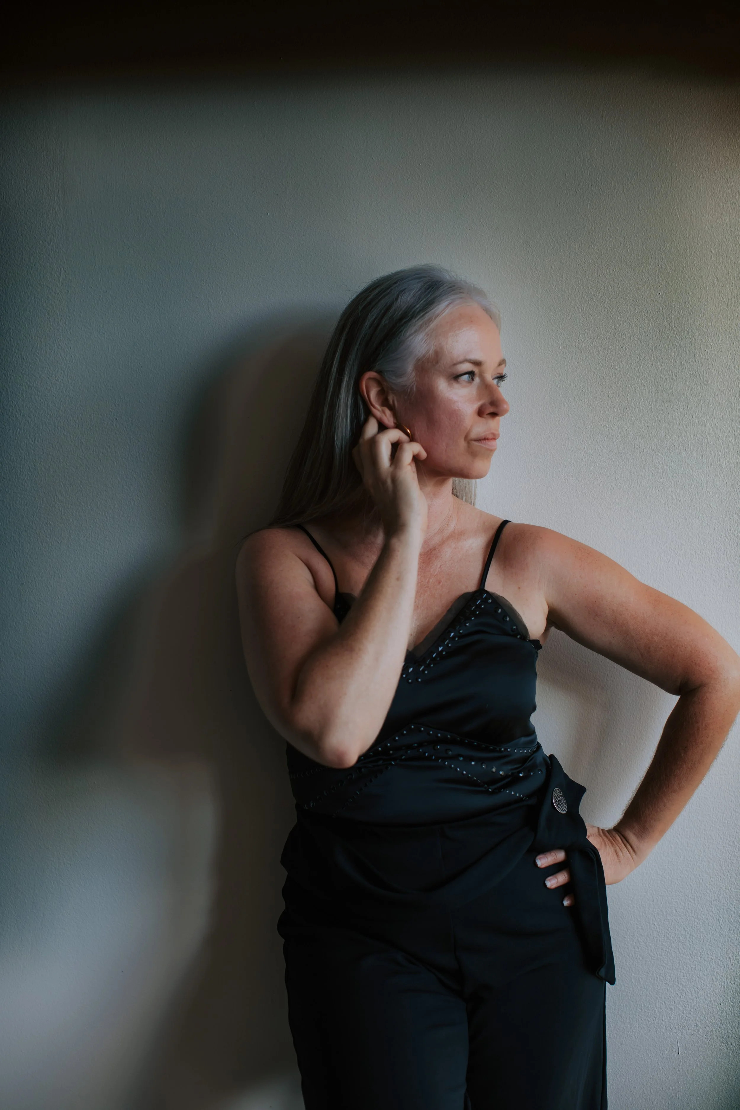 female photographer self portrait black top