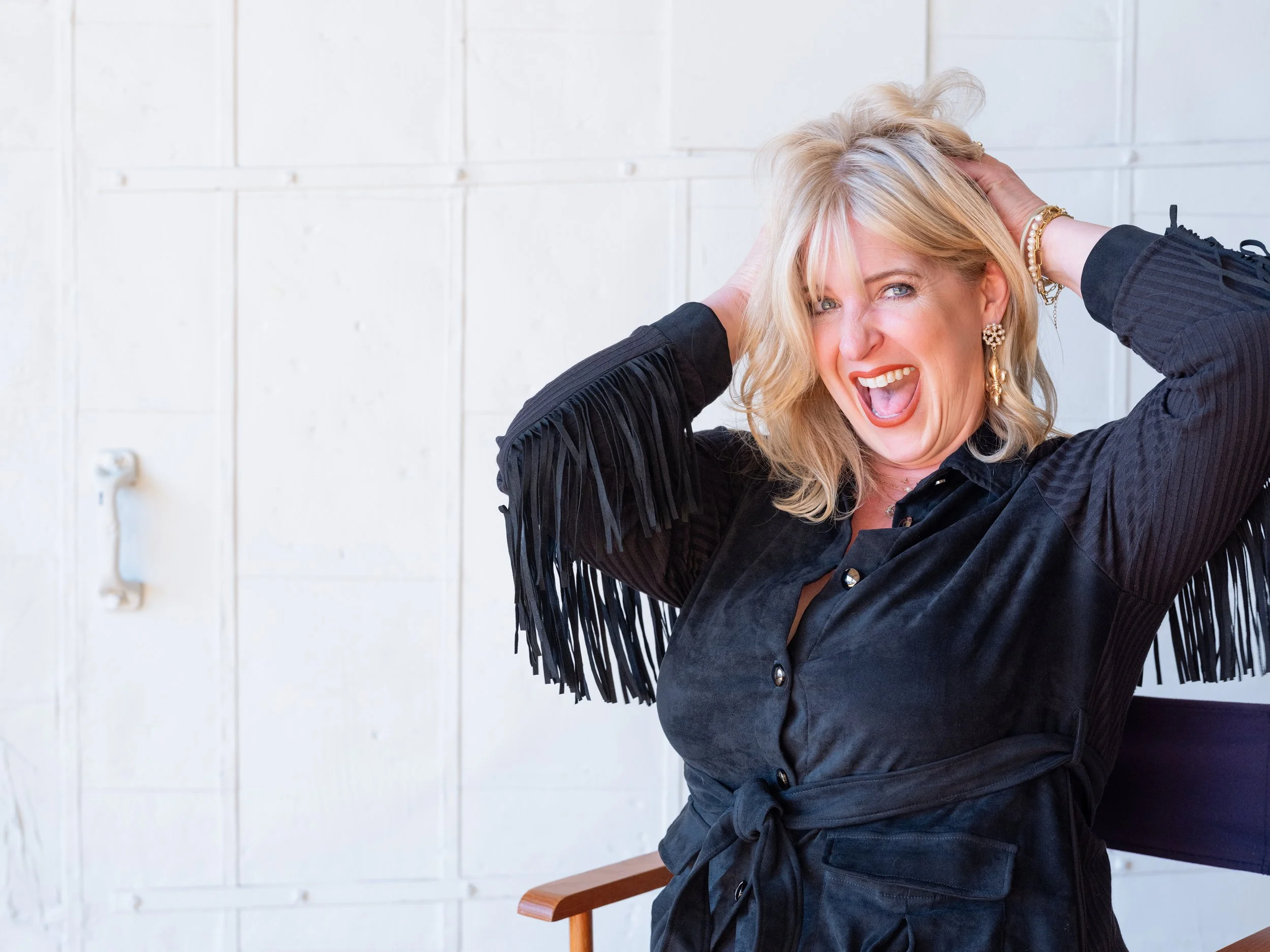 Natural light branding portrait of a professional makeup artist inside The Pointe in NULU, Louisville.