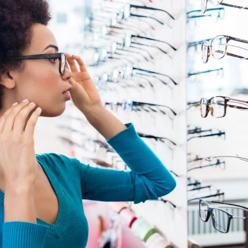 A person trying on glasses.