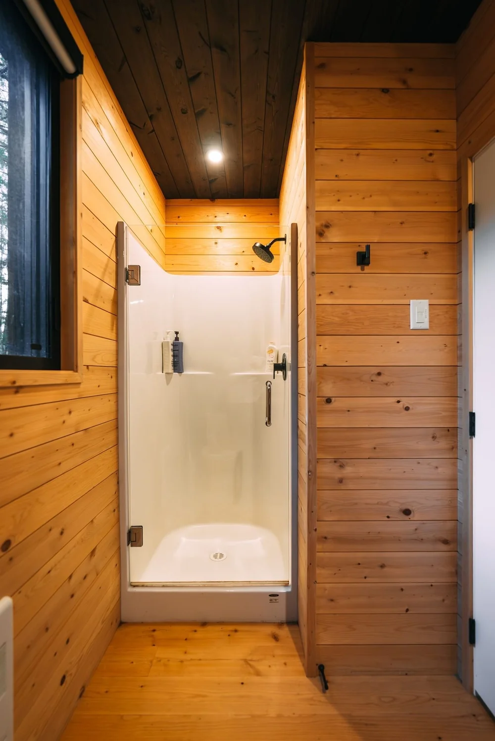 Step-in shower and cedar walls in the bathroom