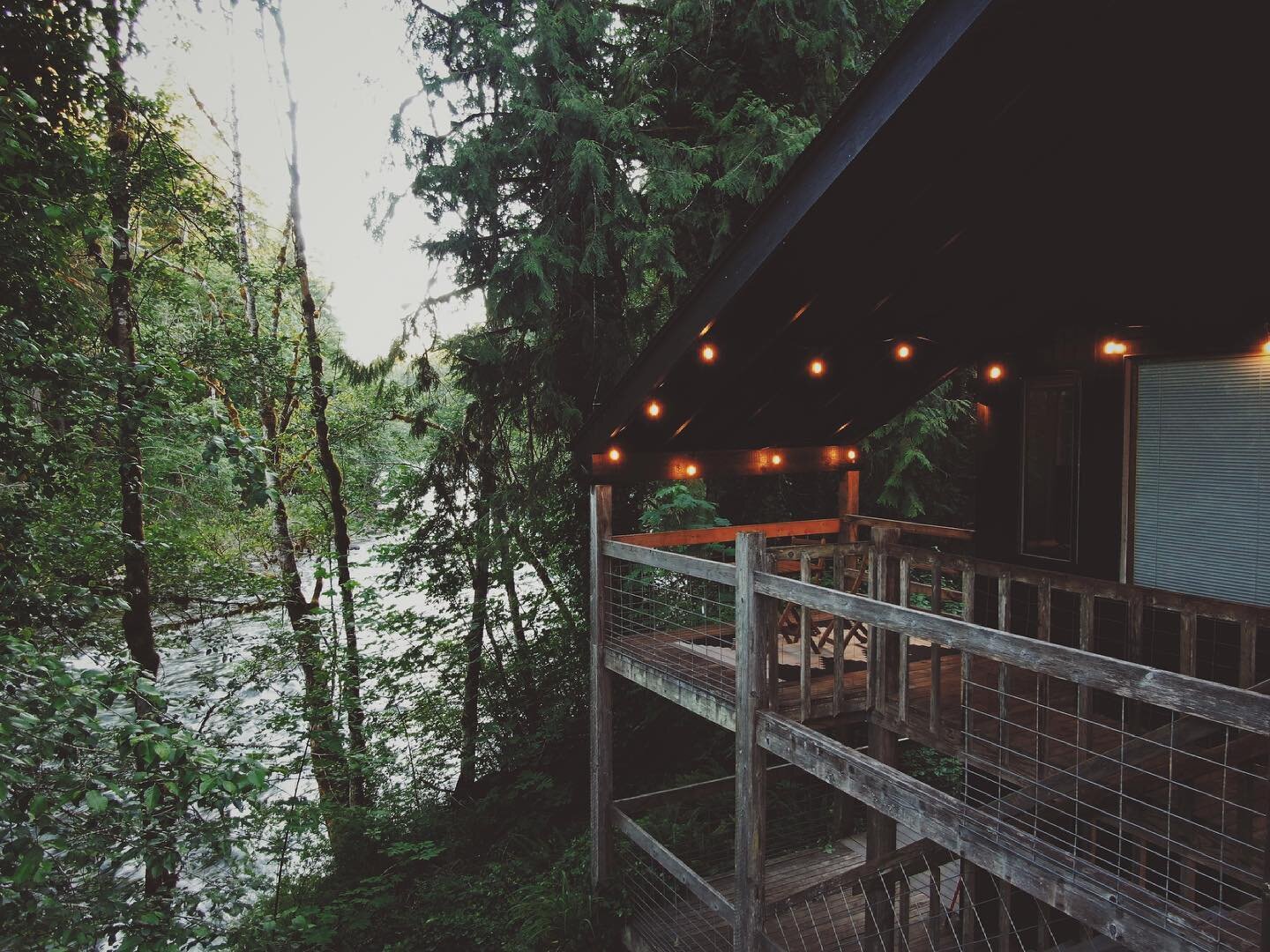 Cozy summer nights at the McKenzie River cabin getaway. Upper and Lower spaces are available or rent the whole place for larger groups. The sound of the rushing river soothes the soul.