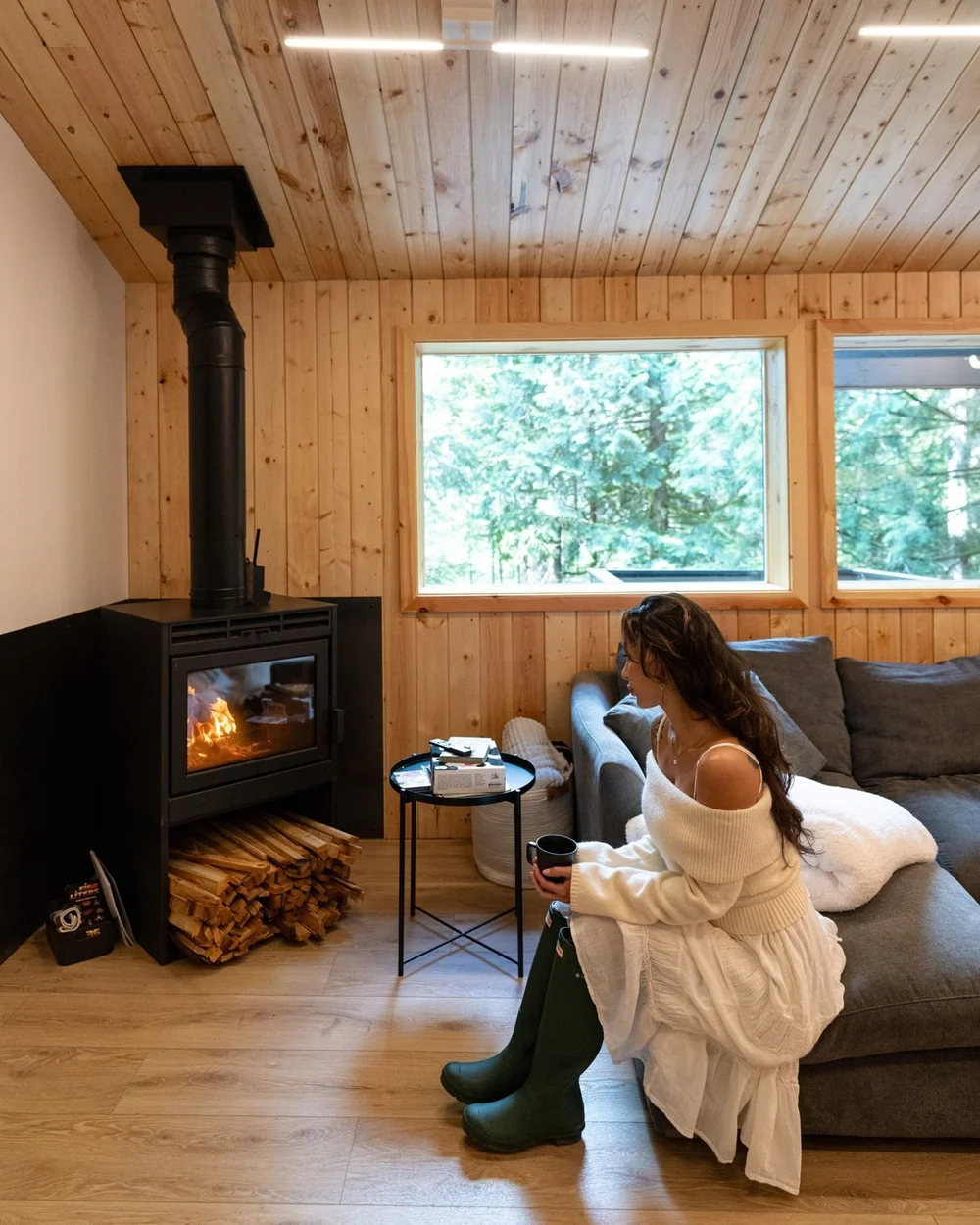 Warming up by the wood stove with a mug of coffee
