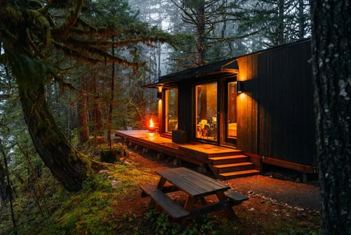 The tiny home deck at dusk on the McKenzie River