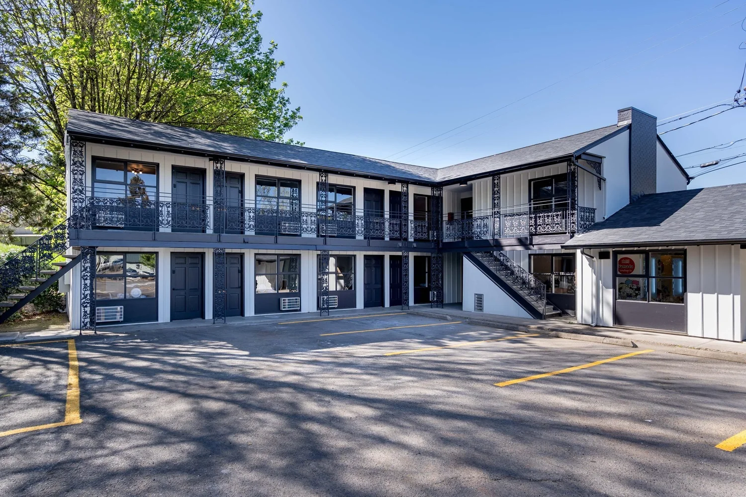 The Local Motel, two floors of rooms around a sunny courtyard