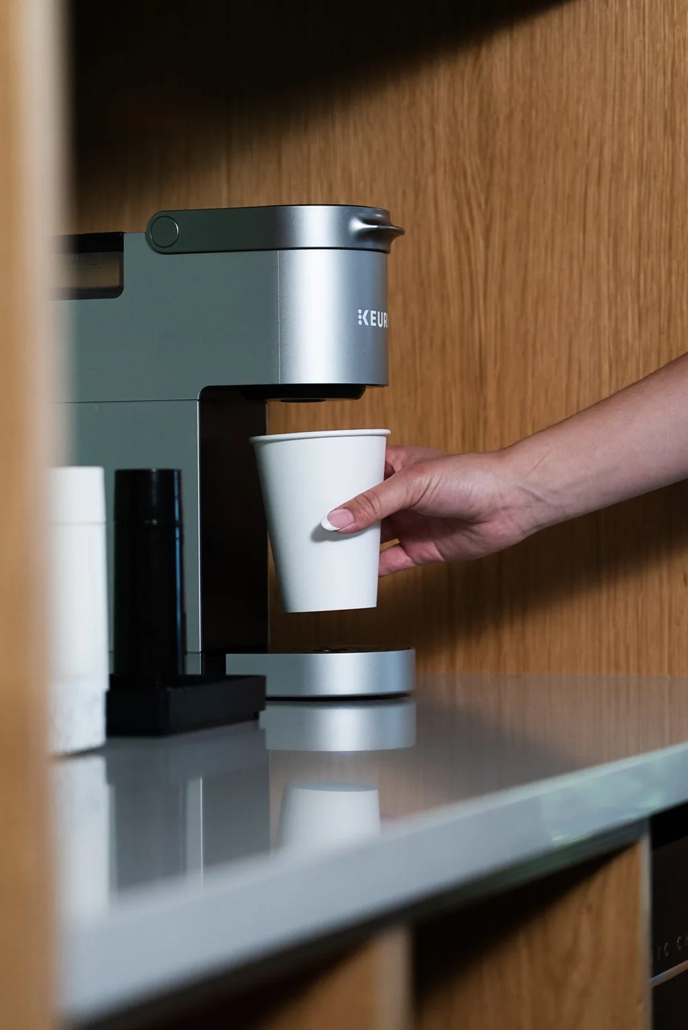 Pouring a cup at the Keurig coffee station