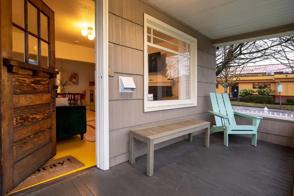 The covered front porch of the bungalow