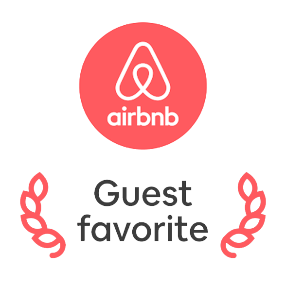 Airbnb guest favorite badge with logo and decorative leaves.