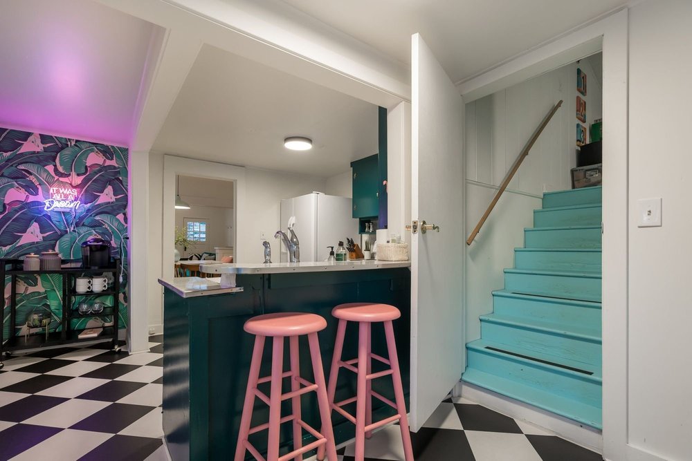 Aqua stairs leading up to the kids’ bedroom and play space
