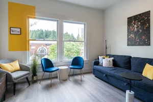 The Artist suite living room with windows over the Market District