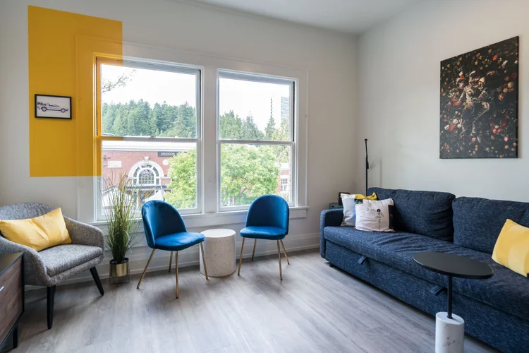 The Artist suite living room with windows over the Market District