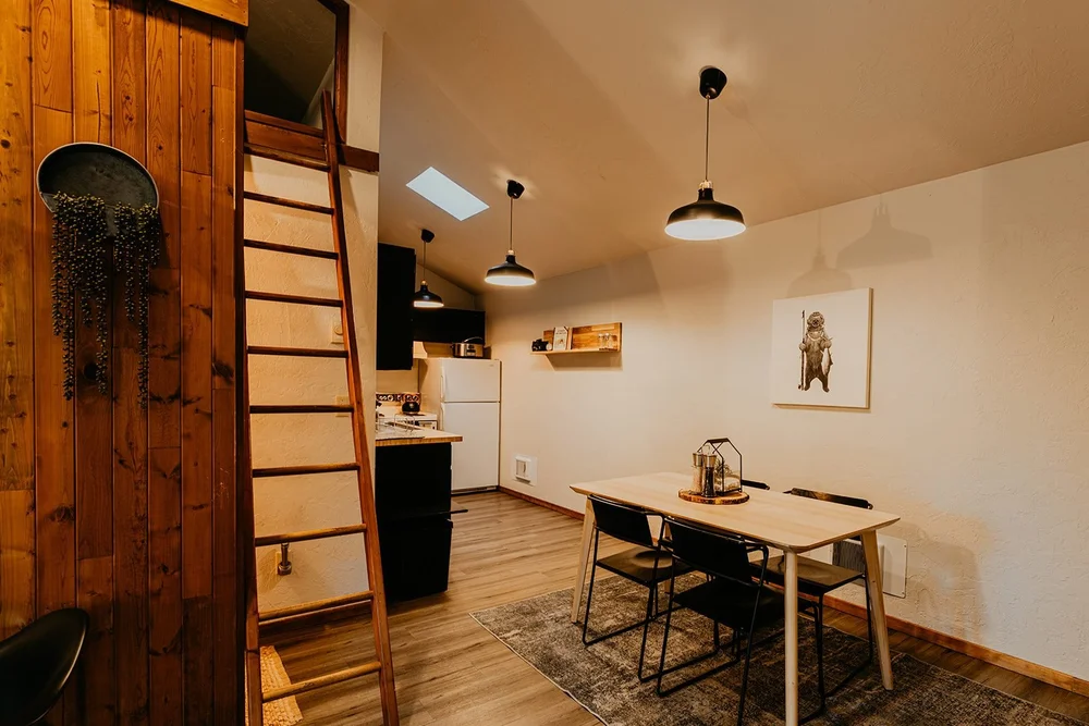 Dining table for six beside the loft ladder