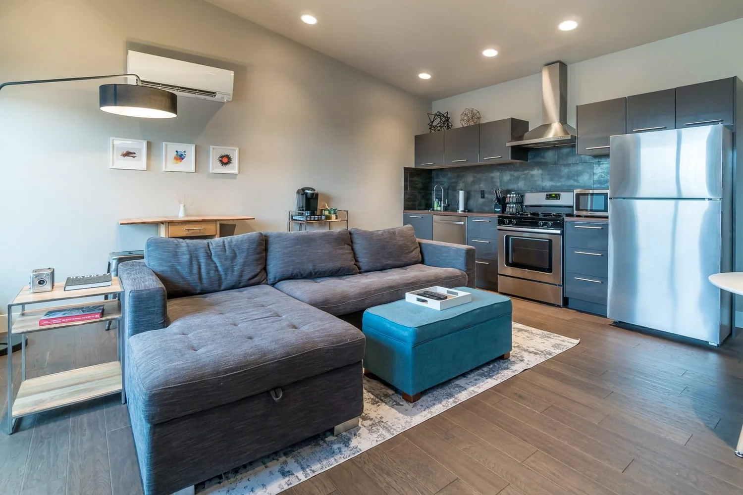 The open living room and kitchen under the vaulted ceiling