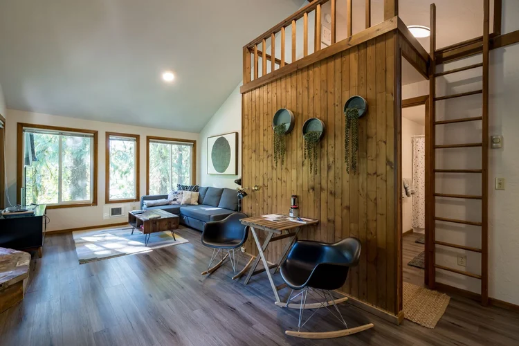 Cedar-paneled loft at the Upper Cabin