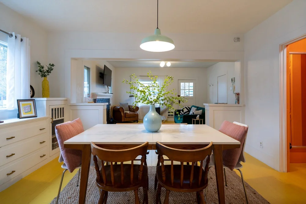 Dining table for 6 with pink and wood chairs