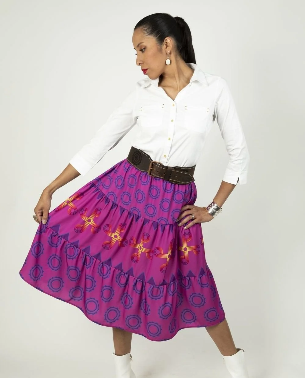 Hauli wears the tiered Summer Sun Circles skirt in signature pink - accessorized with a Sun Circle belt, of course!⁠ ⁠
⁠
Looking for a Sun Circle belt of your own? They're available online now - link to shop in bio ☀️⁠
⁠
Model: @haulisioux⁠
Photo: Ga