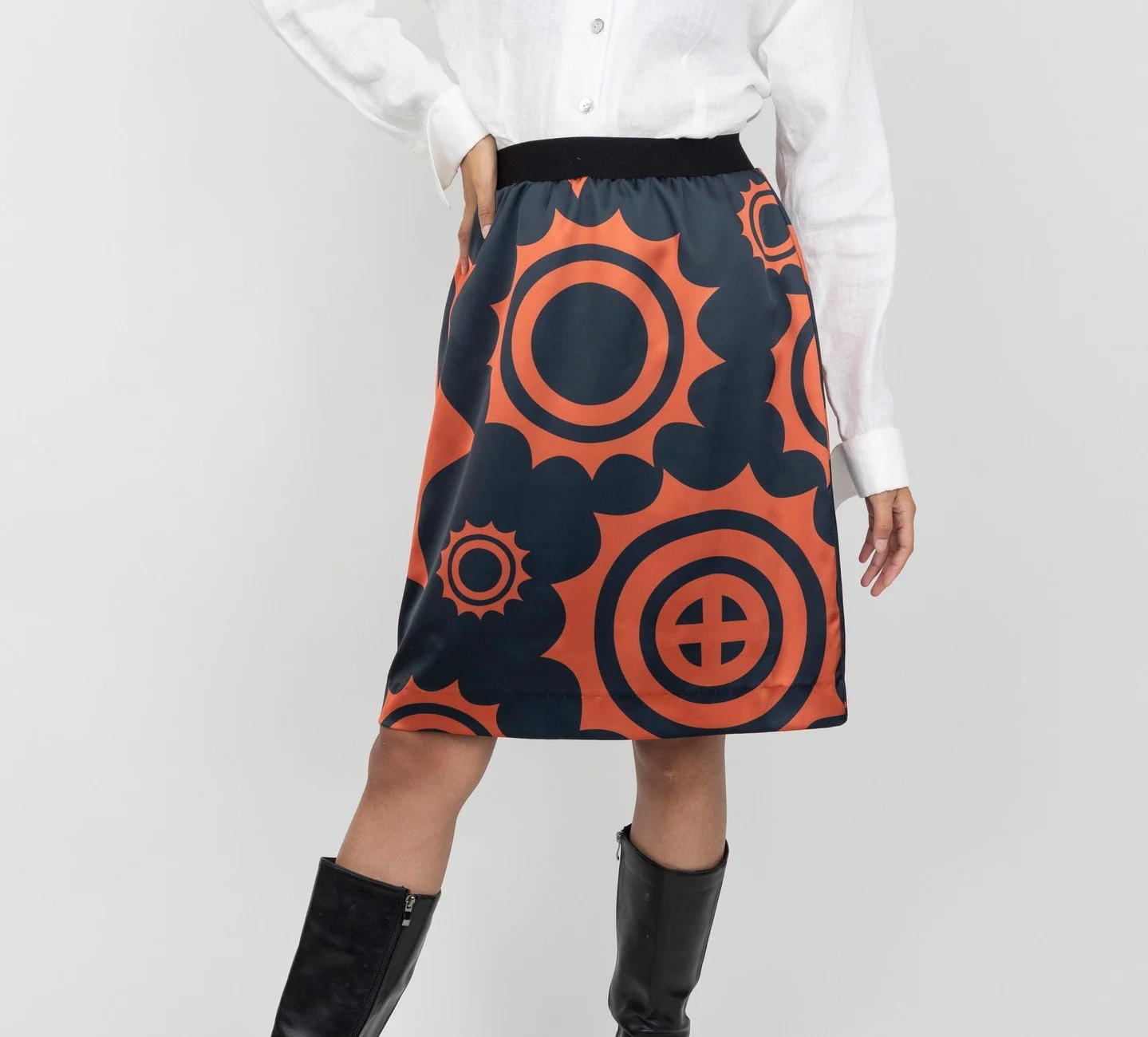 Meet the Winter Copper Skirt ❄️☀️⁠
⁠
The Winter Copper Skirt is made from a large scale Sun Circle print in rich copper and classic black. With a soft drape and elastic waistband, it's as comfortable as it is flattering ✨️⁠
⁠
The entire Winter Copper