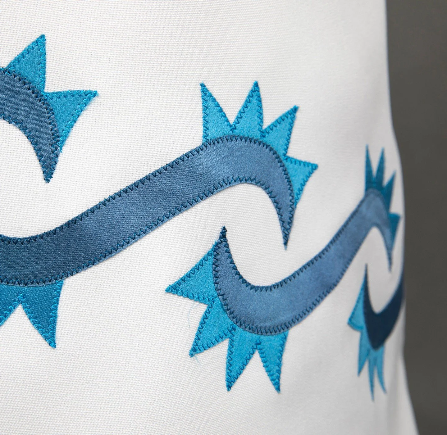 Attention to detail is crucial! Here&rsquo;s a close-up of Leslie's unique 💧 Water Dress created in 2025. Each meticulously hand-cut applique motif symbolizes sacred water or entities associated with it. Check out the precision machine stitching.🩵
