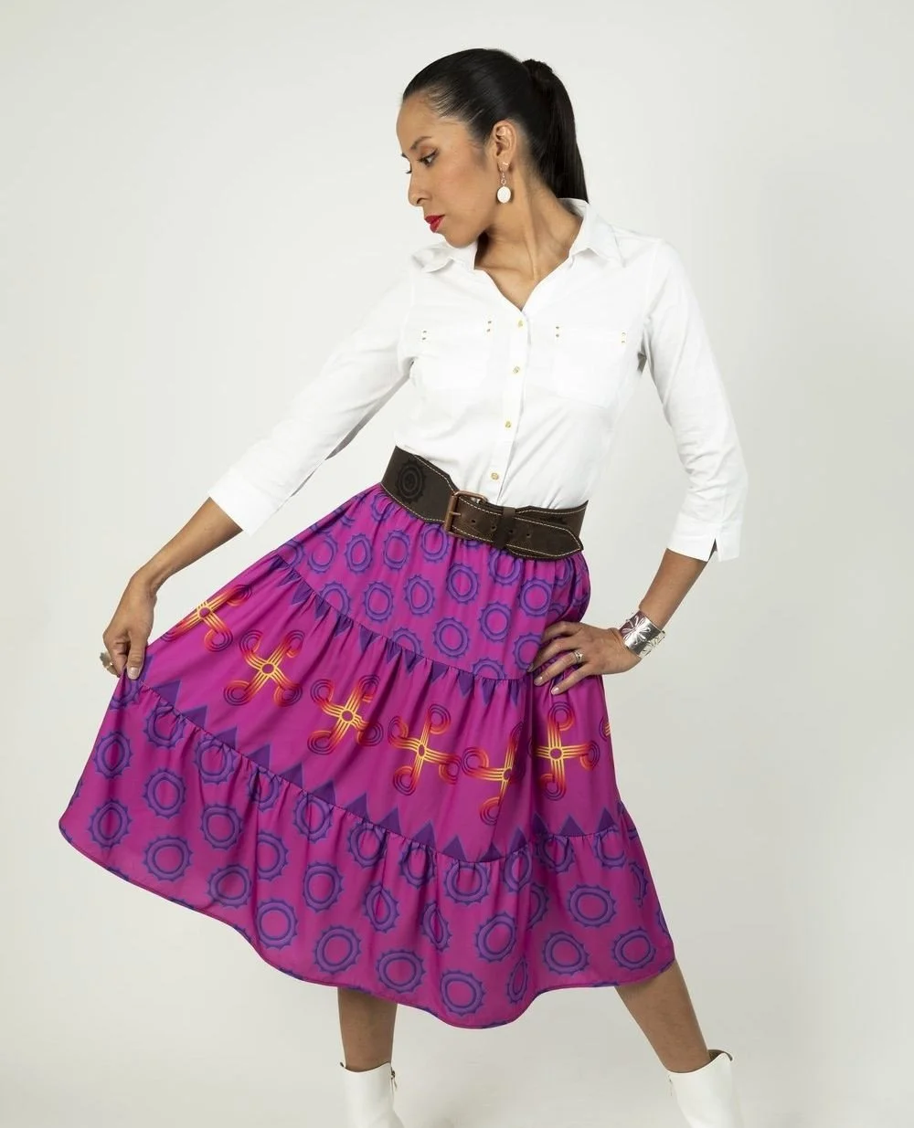 Hauli wears the tiered Summer Sun Circles skirt in signature pink - accessorized with a Sun Circle belt, of course!⁠ ⁠
⁠
Looking for a Sun Circle belt of your own? They're available online now - link to shop in bio ☀️⁠
⁠
Model: @haulisioux⁠
Photo: Ga