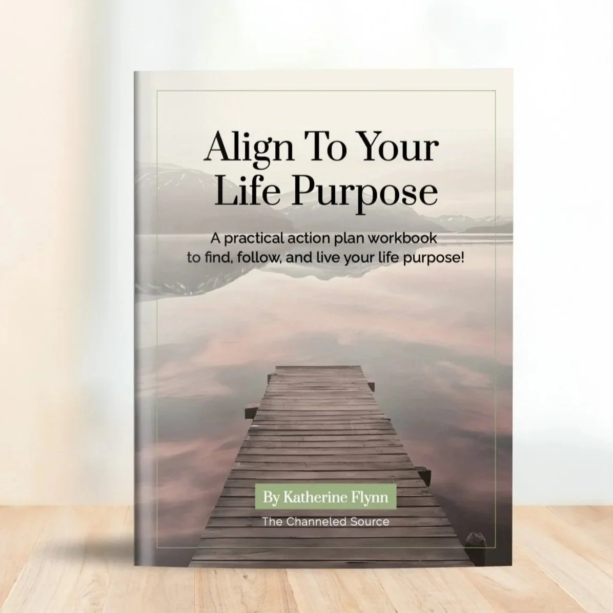 Book titled 'Align To Your Life Purpose' by Katherine Flynn, featuring a dock extending over a calm lake with mountains in the background.