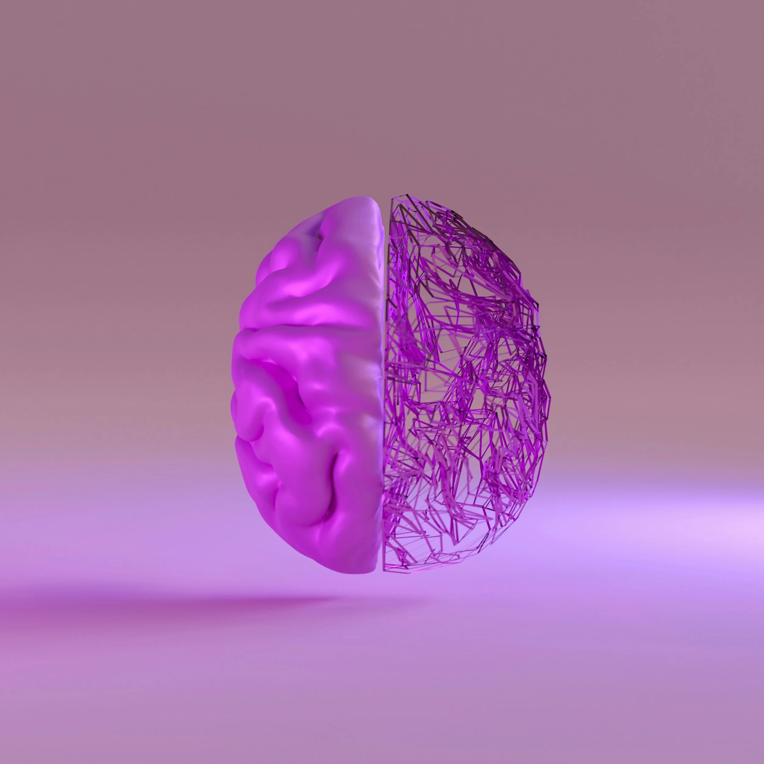 A 3D digital illustration of a human brain, half solid with a soft purple glow, and half skeletal with purple wireframe structure, set against a soft pink background.
