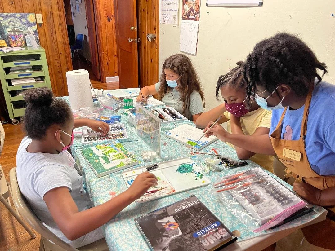 Children enjoying Tracey Mitchell's class learning about color and line.