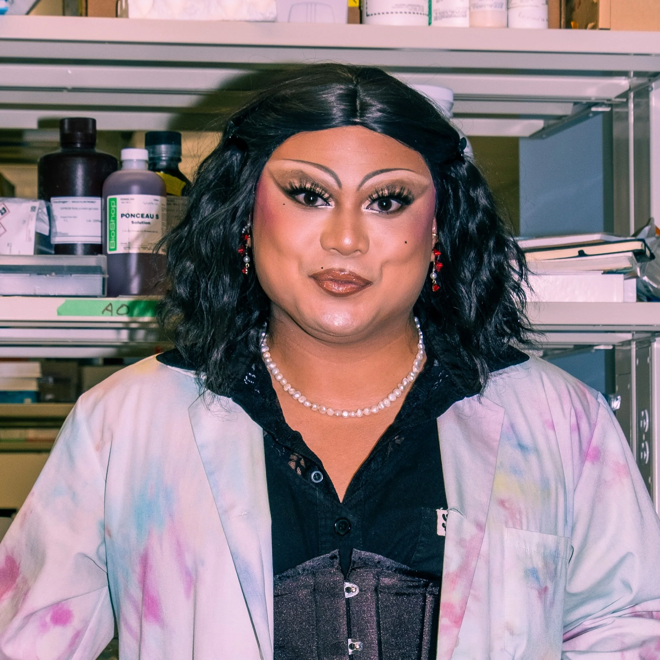 Kwaga Musselle, a drag performer, enthusiastically speaking into a microphone