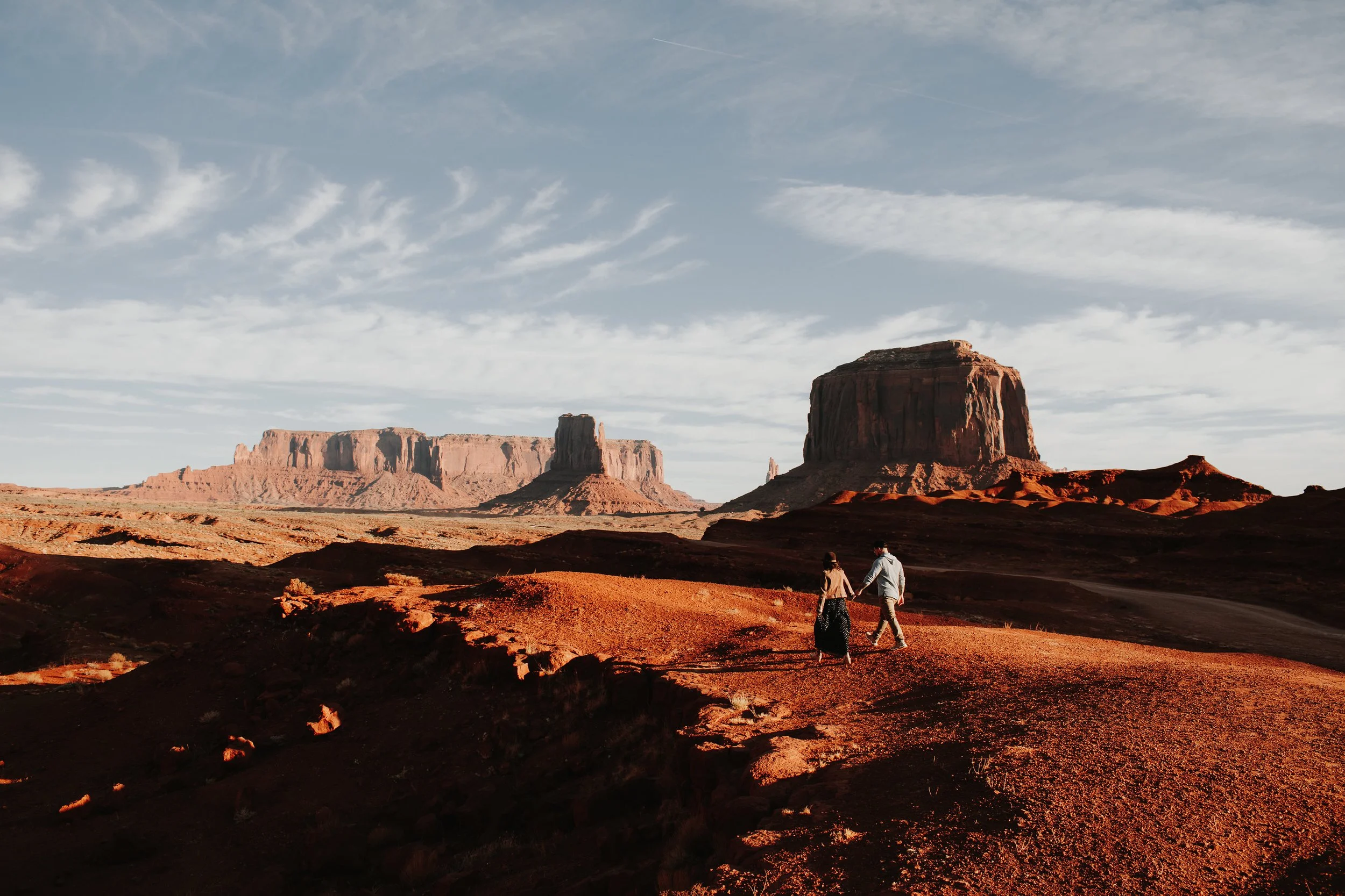 couple during their engagement photography shoot in Monument Valley